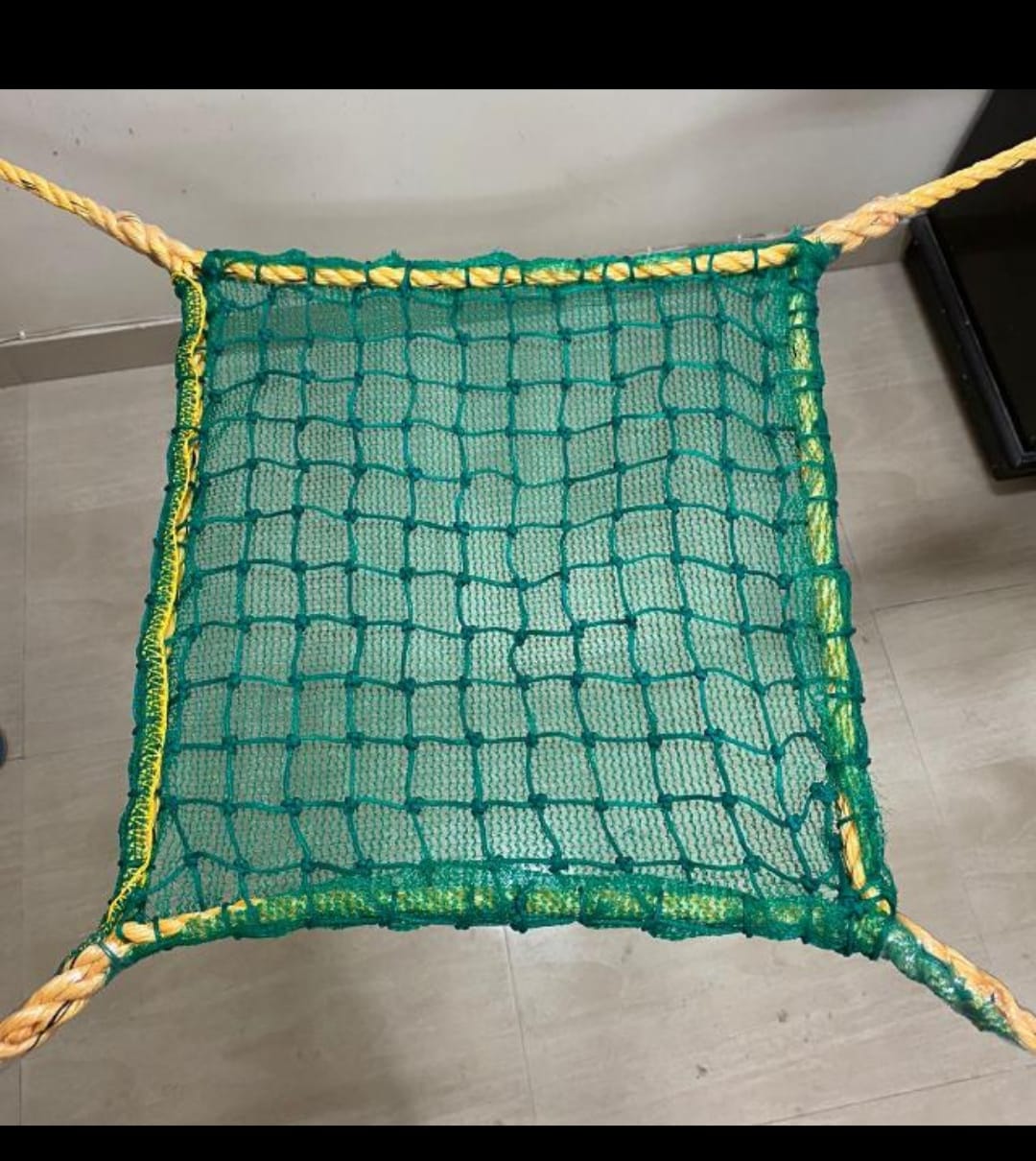 Safety net secured around a high-rise balcony